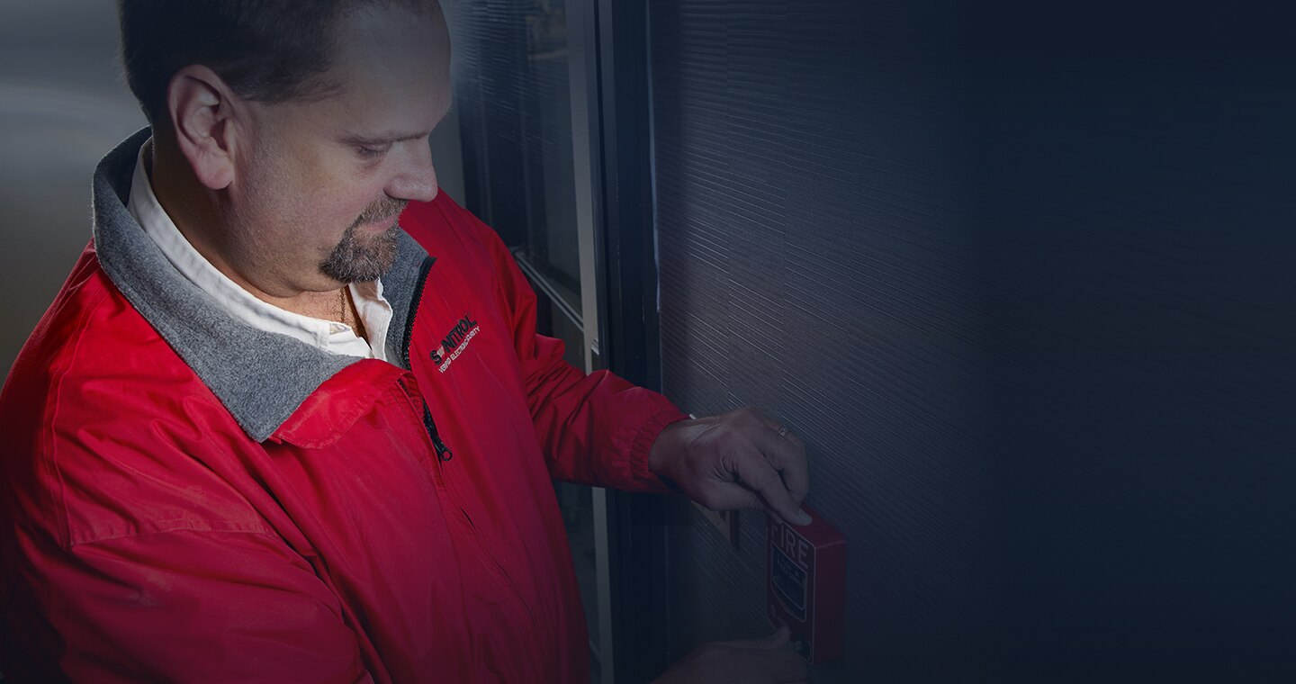 SONITROL employee tests fire detection.