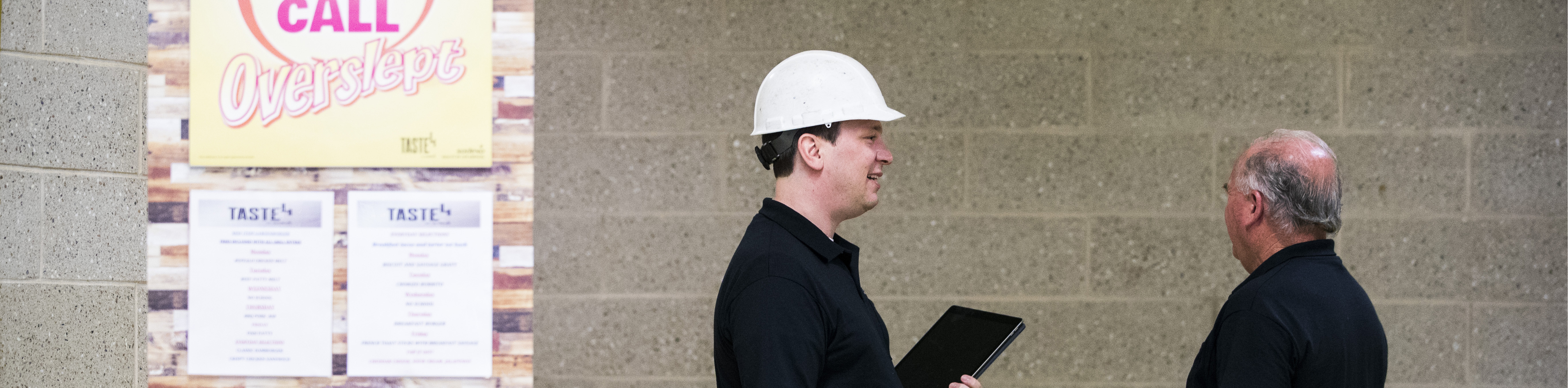 two sonitrol employees inside school installing security camera