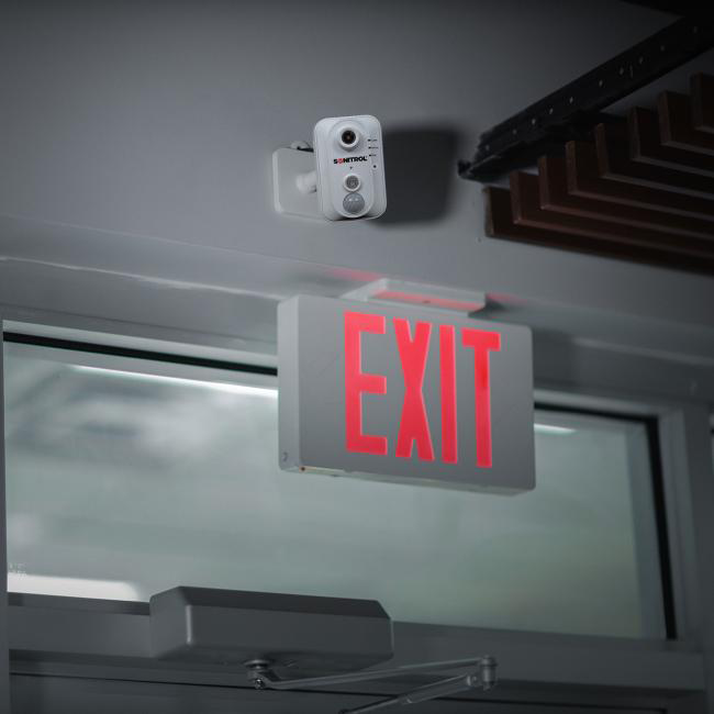 SONITROL TotalGuard Image 042523 TotalGuard System placed above an exit sign