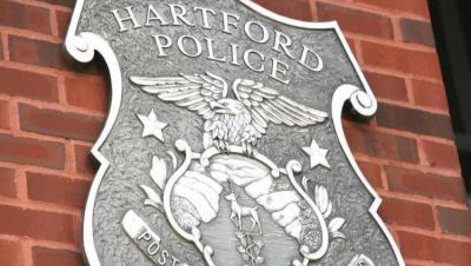 Hartford PD large shield logo on brick wall
