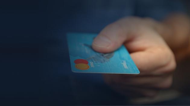 Hand holding a credit card.