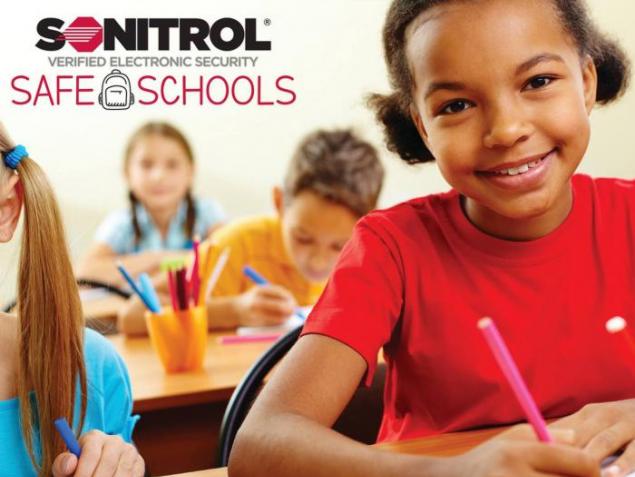 Smiling student next to Sonitrol Safe Schools graphic