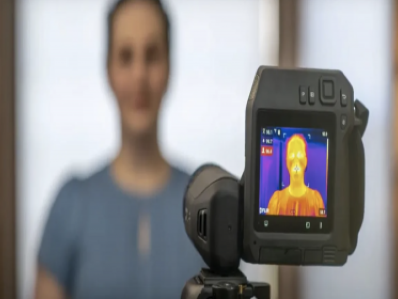 Device visually scanning person's body temperature