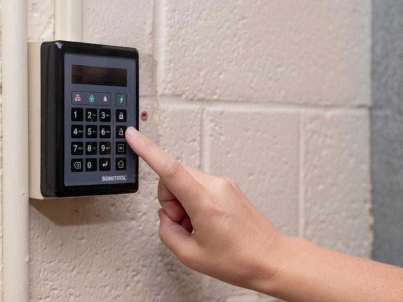 a woman uses the SONITROL CORE Keypad